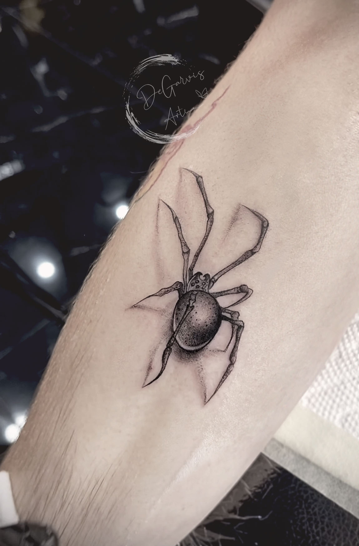 Spider tattoo located on the ankle microrealistic